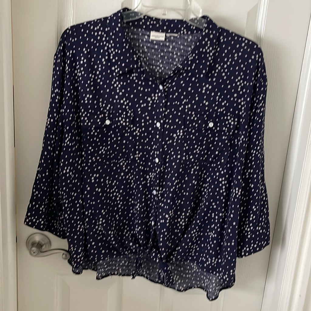 A Navy Blue Blouse With Tiny Stars Throughout.